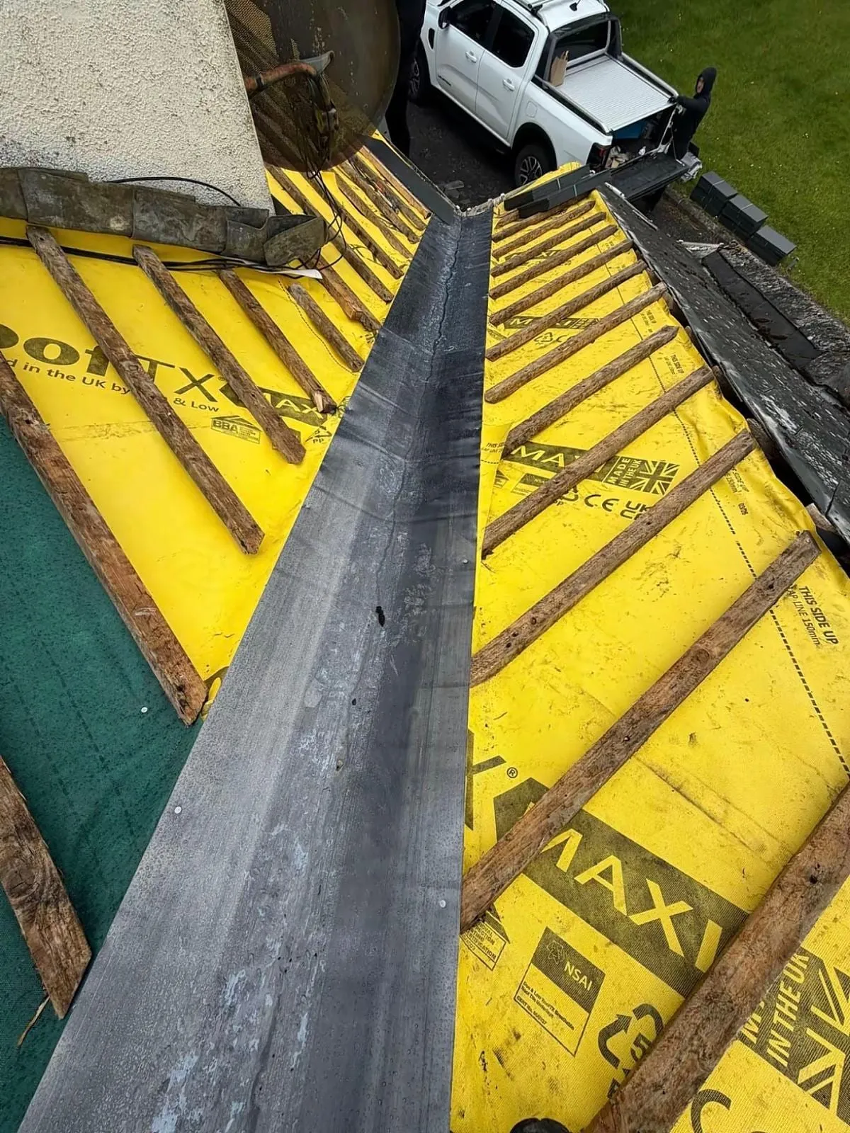 Lead valley gutter laid over yellow breathable membrane and battens