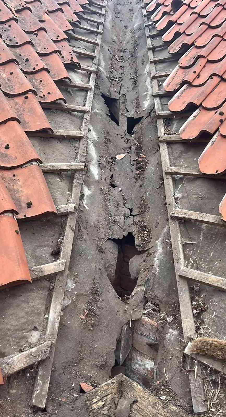 Valley stripped back to show the rotten boards underneath
